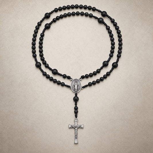 Black Compact Everyday Rosary with matte beads, a Miraculous Medal centerpiece, and a silver-tone crucifix.