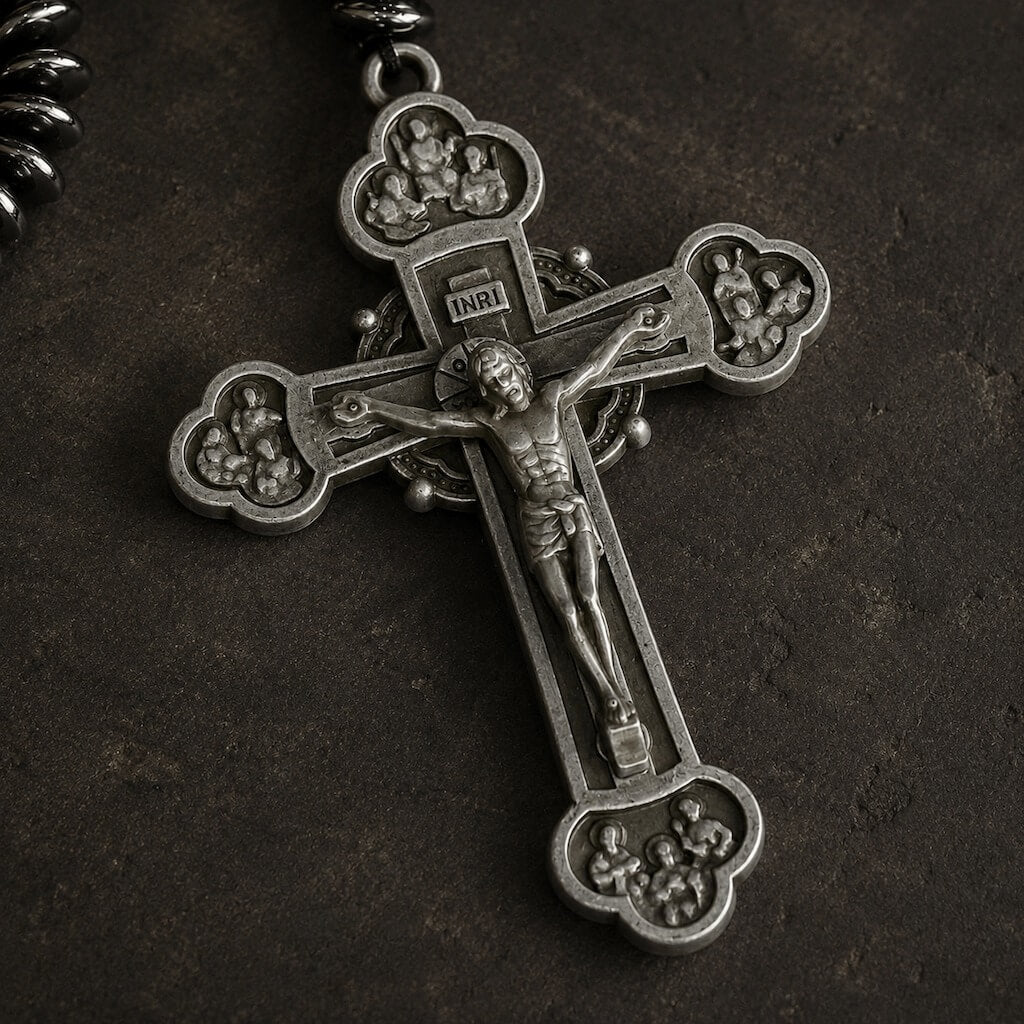 Close-up of the ornate antiqued silver-tone crucifix on the Heritage St. Benedict five-decade rosary.